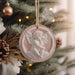 a christmas ornament hanging from a christmas tree