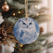 an ornament hanging from a christmas tree