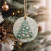 a christmas tree ornament hanging from a christmas tree