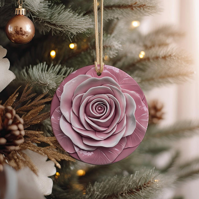 a pink ornament hanging from a christmas tree