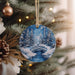 a christmas ornament hanging from a christmas tree