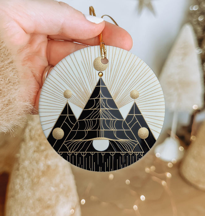 a person holding a christmas ornament in their hand