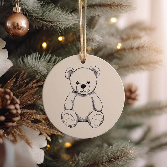 a christmas ornament with a picture of a teddy bear on it