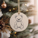 a christmas ornament with a picture of a teddy bear on it