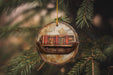 a christmas ornament hanging from a tree