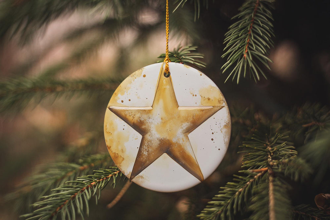a star ornament hanging from a christmas tree