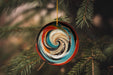 a glass ornament hanging from a tree