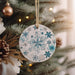 a christmas ornament hanging from a christmas tree