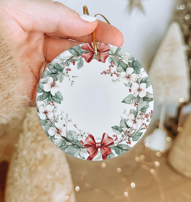 a person holding a christmas ornament in their hand