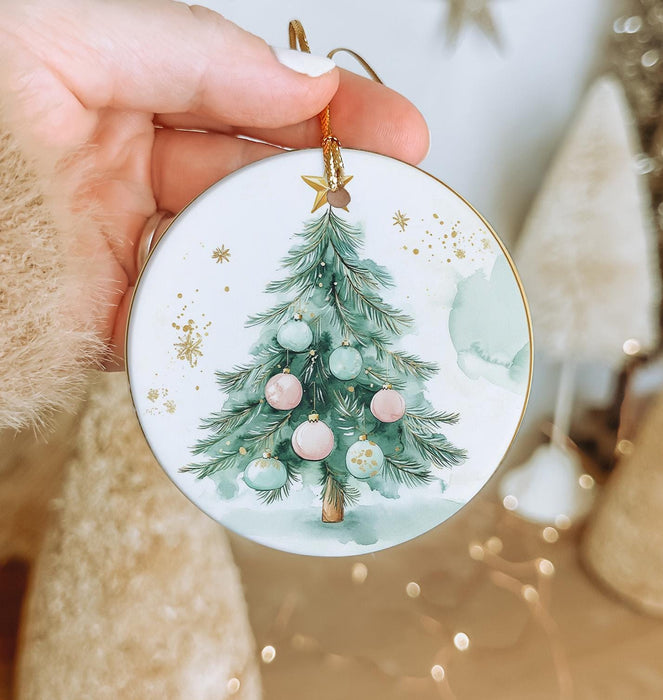 a person holding a christmas ornament in their hand