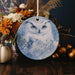 a ceramic ornament with a picture of an owl on it