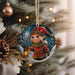a christmas ornament hanging from a christmas tree