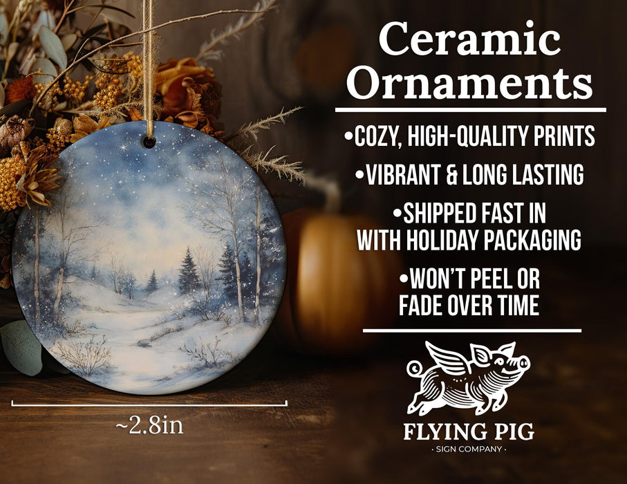 a ceramic ornament with a winter scene on it