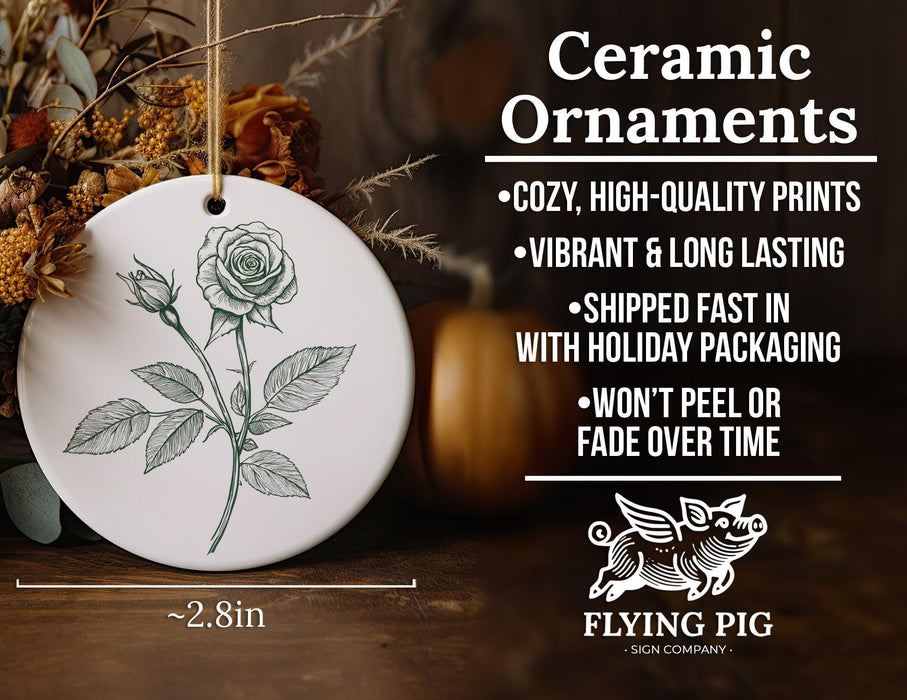 a ceramic ornament with a drawing of a rose