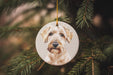 a dog ornament hanging from a christmas tree