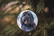 a dog ornament hanging from a christmas tree
