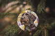 a dog ornament hanging from a christmas tree