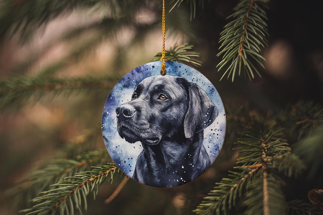 a black dog ornament hanging from a christmas tree