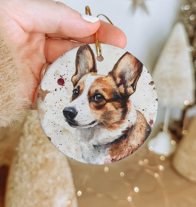 a hand holding a small ornament with a picture of a dog on it