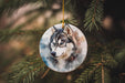 a wolf ornament hanging from a christmas tree