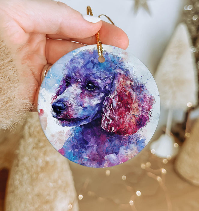 a hand holding a purple poodle ornament