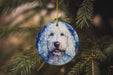 a dog ornament hanging from a christmas tree