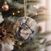 a picture of a wolf ornament hanging from a christmas tree