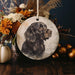 a ceramic ornament with a picture of a dog on it