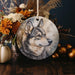a ceramic ornament with a picture of a wolf on it