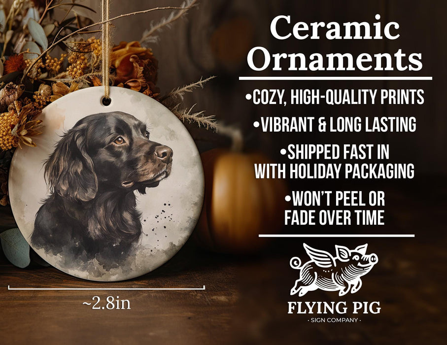 a ceramic ornament with a black dog on it