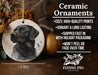a ceramic ornament with a black dog on it