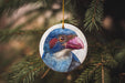 a blue bird ornament hanging from a tree
