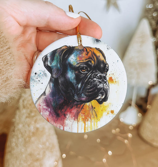 a hand holding a round ornament with a picture of a dog on it