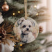 a dog ornament hanging on a christmas tree