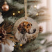 a dog ornament hanging from a christmas tree