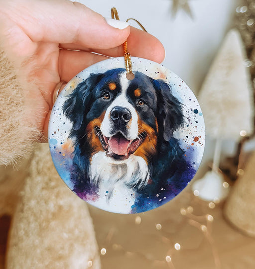 a hand holding a christmas ornament with a picture of a dog