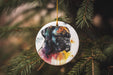 a ceramic ornament hanging from a christmas tree