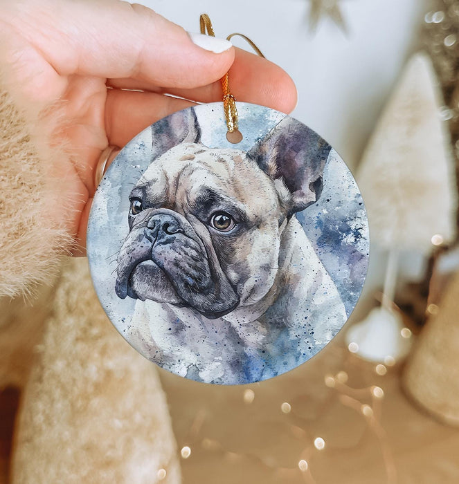 a hand holding a round ornament with a picture of a dog on it