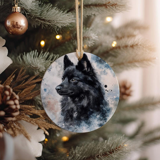 a black dog ornament hanging from a christmas tree