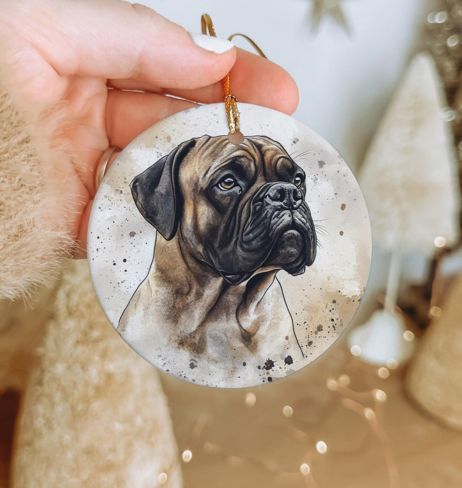 a hand holding a christmas ornament with a picture of a dog