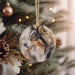 a dog ornament hanging from a christmas tree