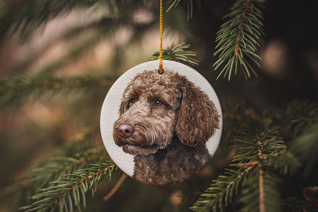 a dog ornament hanging from a christmas tree
