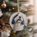 a dog ornament hanging from a christmas tree