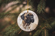 a dog ornament hanging from a christmas tree