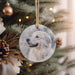 a white dog ornament hanging from a christmas tree