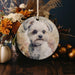 a ceramic ornament with a picture of a dog on it