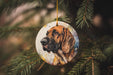 a dog ornament hanging from a christmas tree