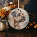 a christmas ornament with a picture of a dog on it