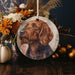a picture of a dog is hanging on a table