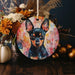 a painting of a dog on a round ornament